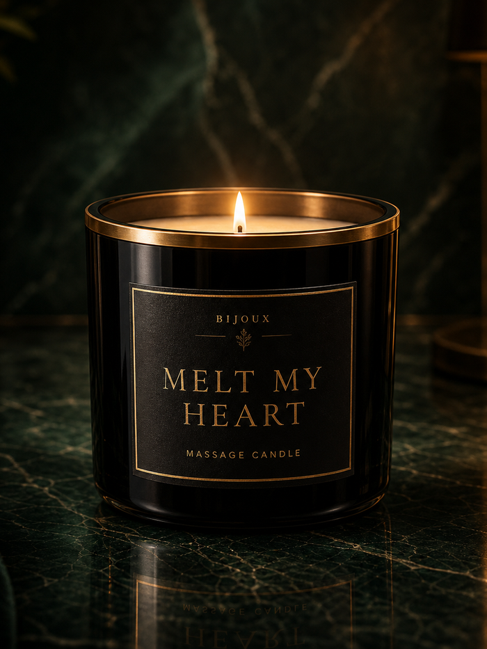 Melt My Heart Aphrodisia Massage Candle on emerald marble in VELDIS luxury setting